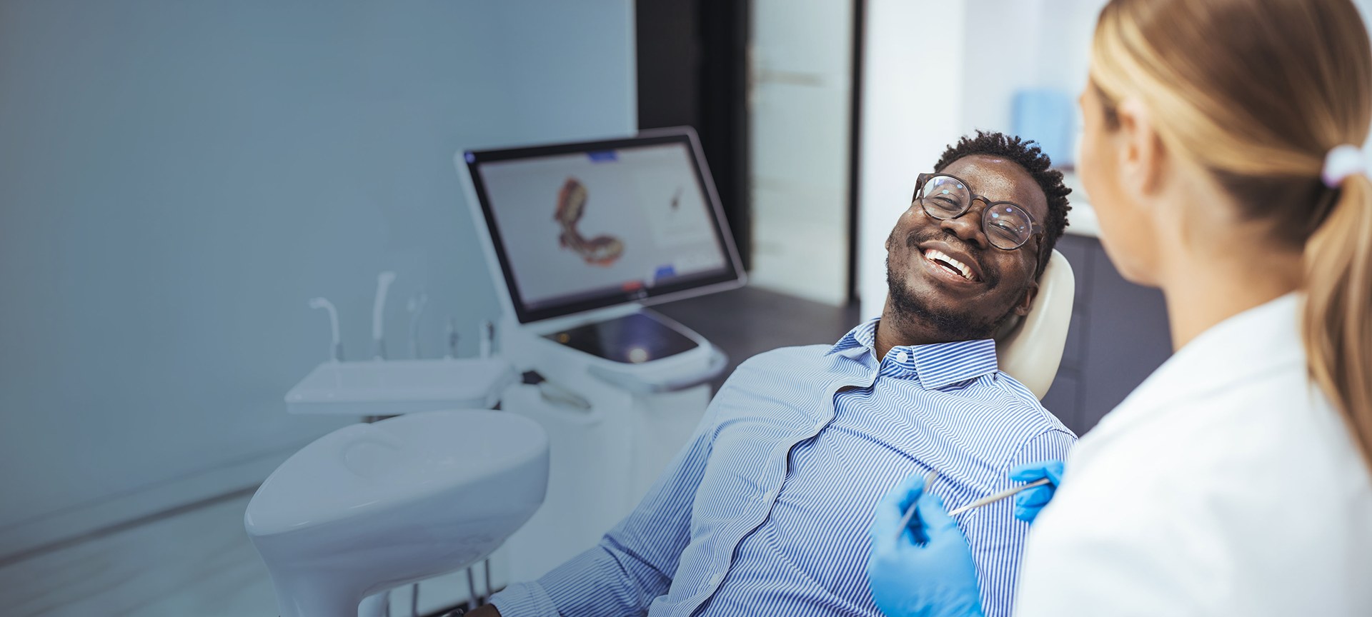 Man talking to dentist