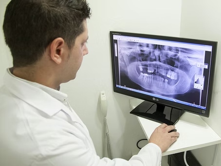 Dentist analyzing exam