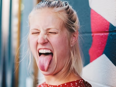 Girl showing tongue