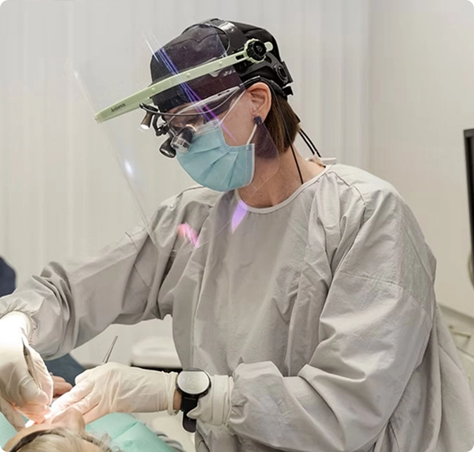 Woman doing dental procedure